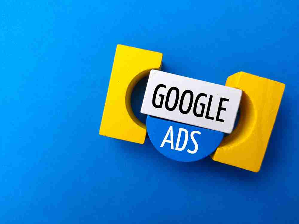 Yellow and blue blocks on a blue background form the words