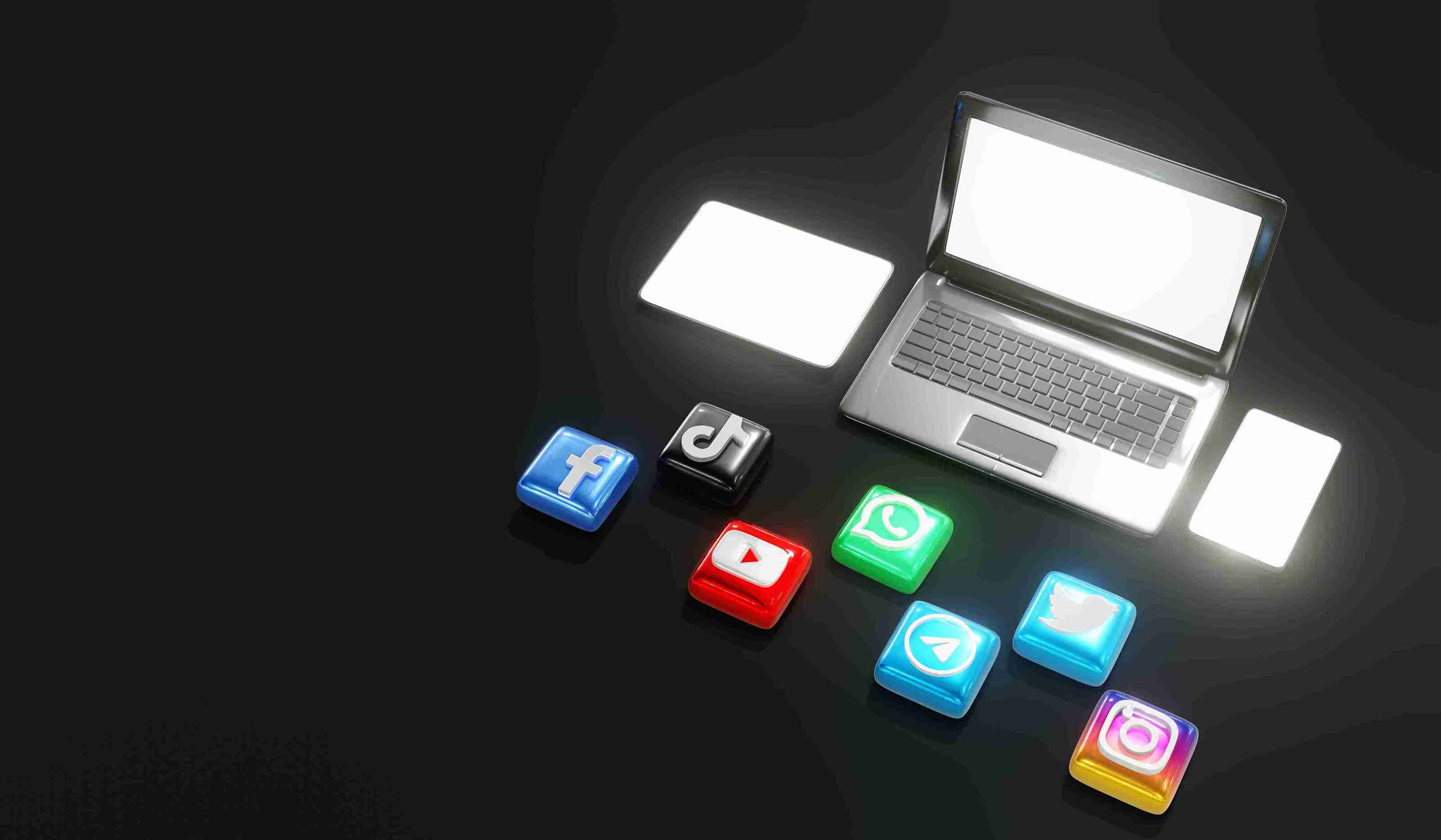 Laptop and glowing gadgets with social media icons on a dark background, featuring Facebook, TikTok, YouTube, WhatsApp, Telegram, Twitter, Instagram.
