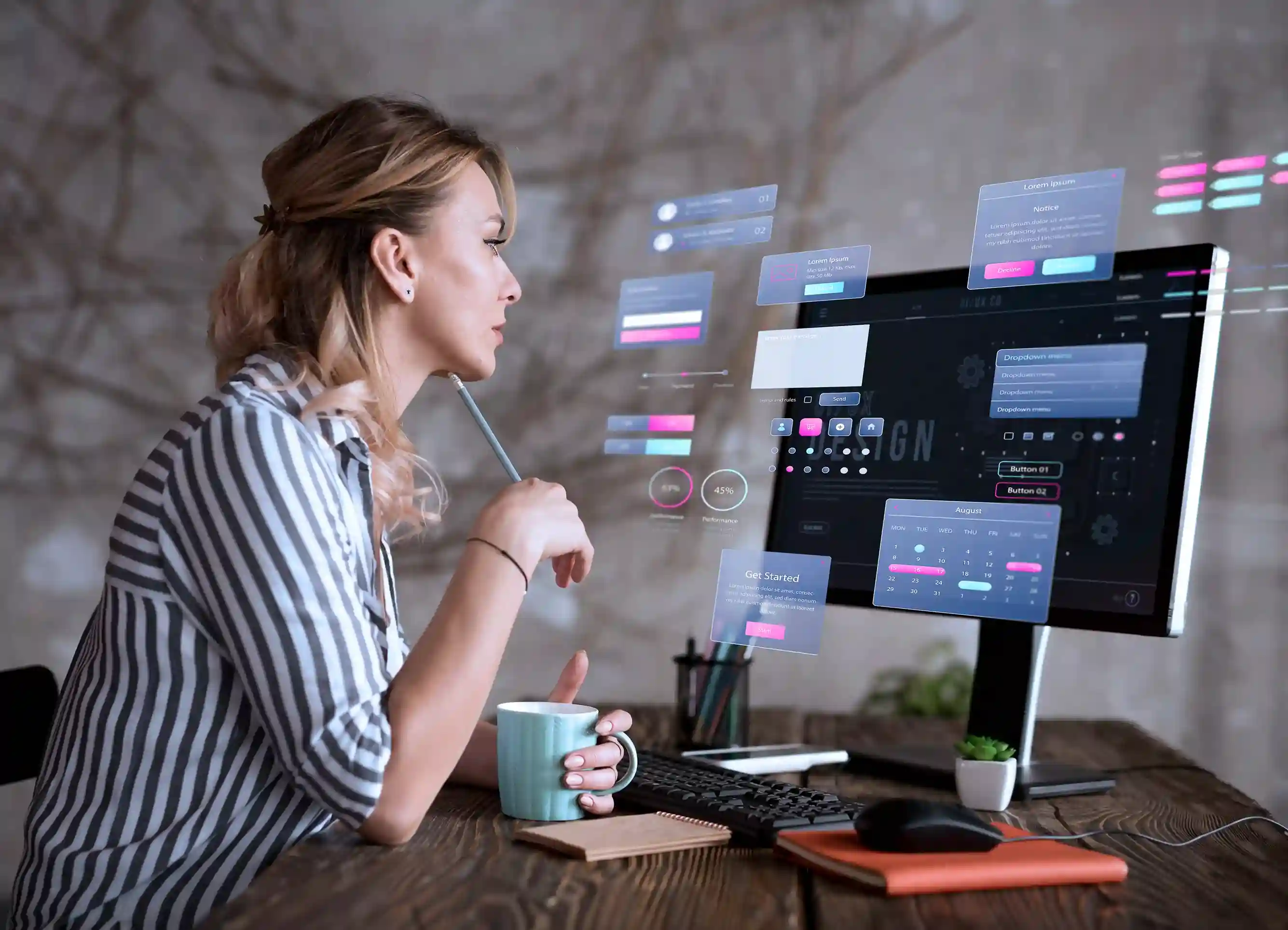 A woman at a desk analyzes floating digital UI designs on a computer. She holds a pen, with a striped shirt and a cup. Techy and focused mood.